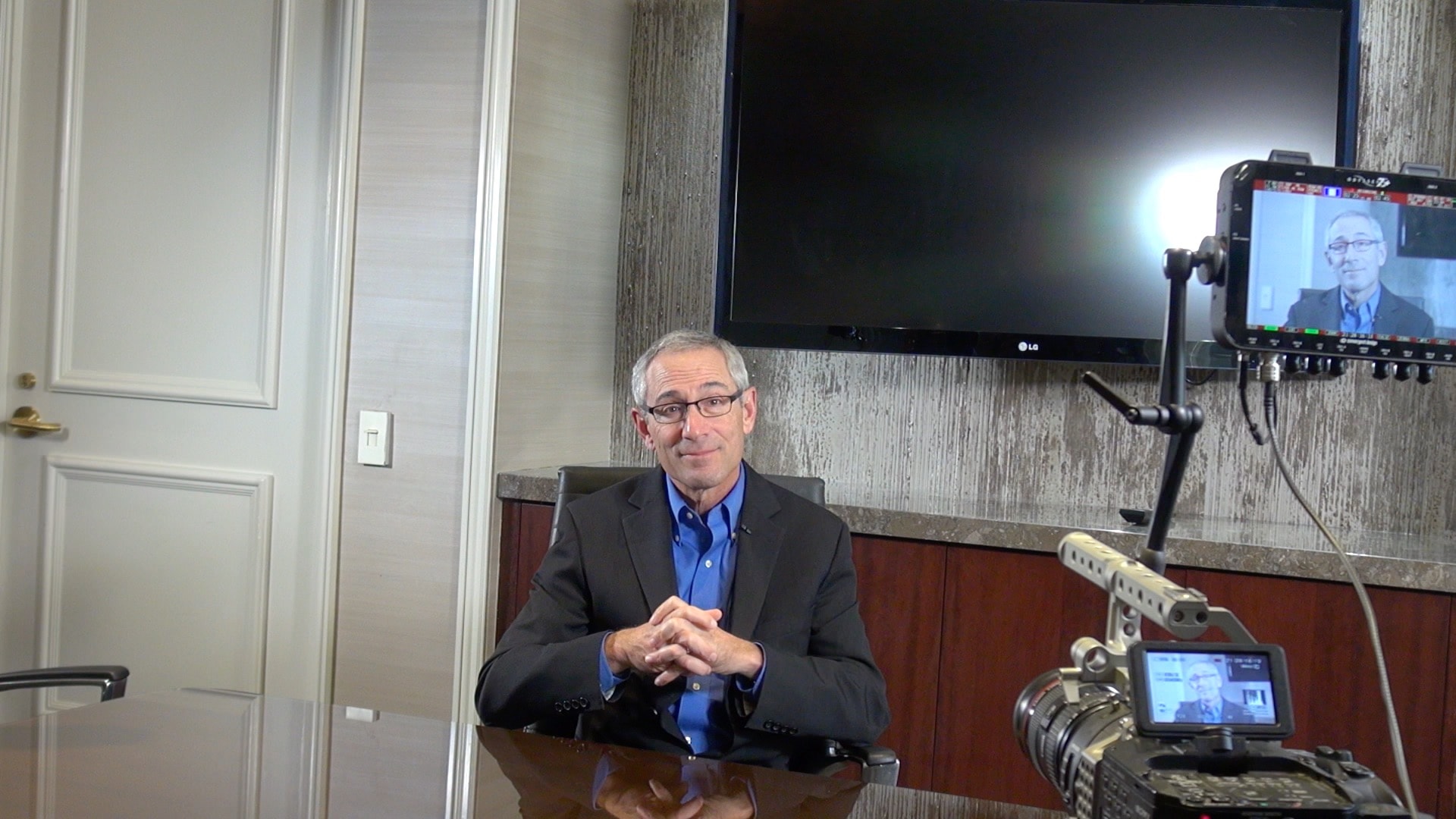 Interview in boardroom with camera